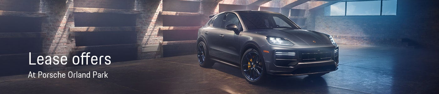 Lease Offers at Porsch Orland Park with a Porsche parked under the entrance to a building